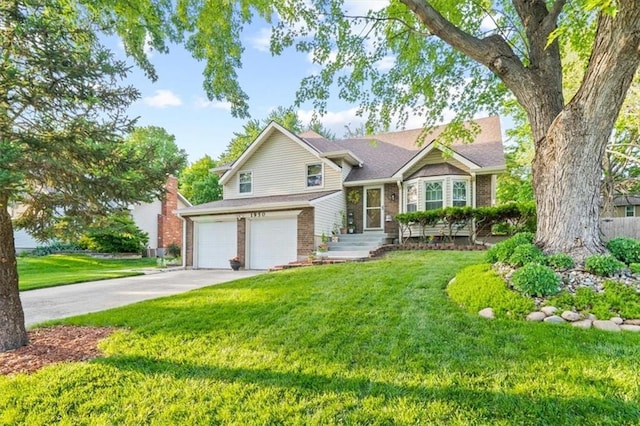 tri-level home with an attached garage, brick siding, driveway, and a front yard
