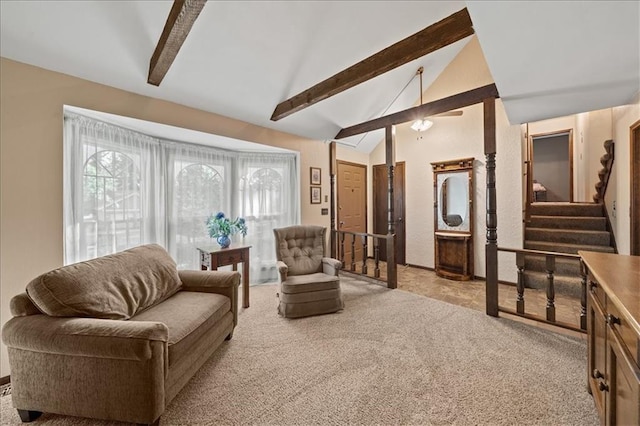 living room with light carpet, stairway, and ceiling fan