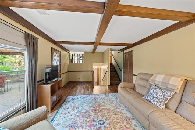 living room featuring wood finished floors, stairs, beam ceiling, baseboards, and coffered ceiling