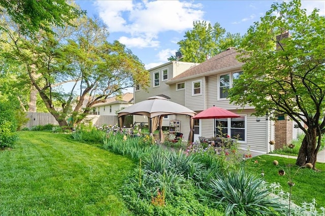 rear view of house with a gazebo