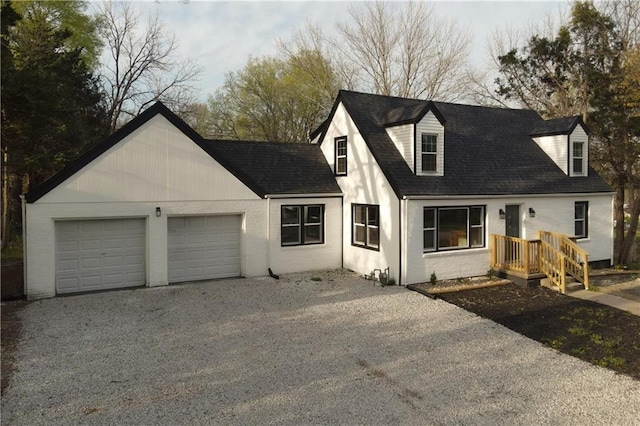 10514 E 35th St S, Independence, MO 64052 - view of front of home featuring gravel driveway, a garage, and a shingled roof
