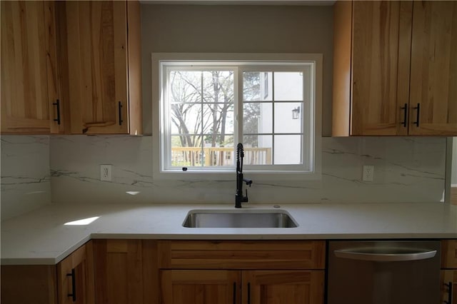 10514 E 35th St S, Independence, MO 64052 - kitchen featuring dishwasher, a sink, decorative backsplash, and light countertops