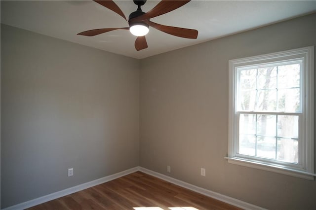 10514 E 35th St S, Independence, MO 64052 - spare room featuring wood finished floors, baseboards, and ceiling fan