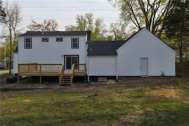 10514 E 35th St S, Independence, MO 64052 - back of property featuring a shingled roof, a wooden deck, and a yard