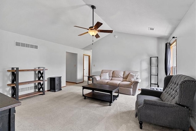 living area featuring vaulted ceiling, carpet flooring, a ceiling fan, and baseboards