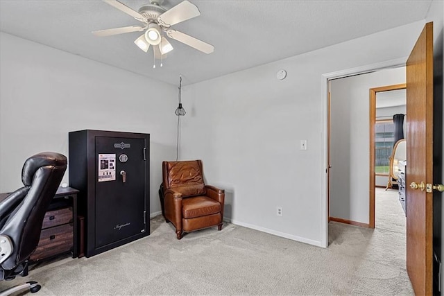 office featuring carpet floors, a ceiling fan, and baseboards