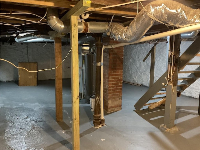 3624 Mersington Ave, Kansas City, MO 64128 - unfinished below grade area with stairway and gas water heater