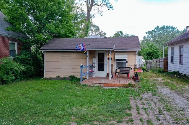 817 S Hardy Ave, Independence, MO 64053 - rear view of house with a deck