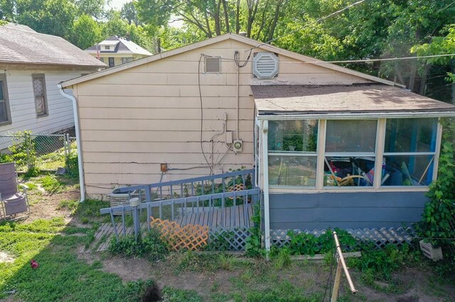 817 S Hardy Ave, Independence, MO 64053 - view of side of property featuring a sunroom and central AC