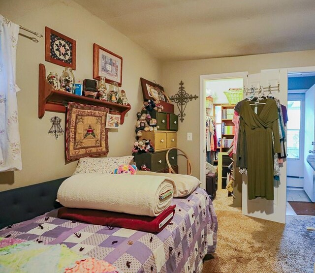 817 S Hardy Ave, Independence, MO 64053 - carpeted bedroom with a baseboard radiator