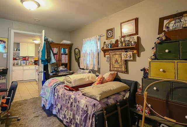 817 S Hardy Ave, Independence, MO 64053 - bedroom with light tile patterned floors and light colored carpet