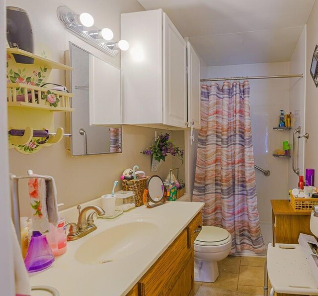 817 S Hardy Ave, Independence, MO 64053 - bathroom with tile patterned flooring, toilet, and vanity
