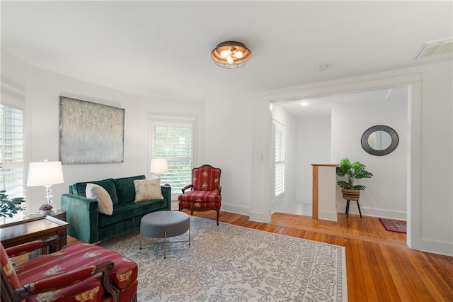 living room featuring wood finished floors and baseboards