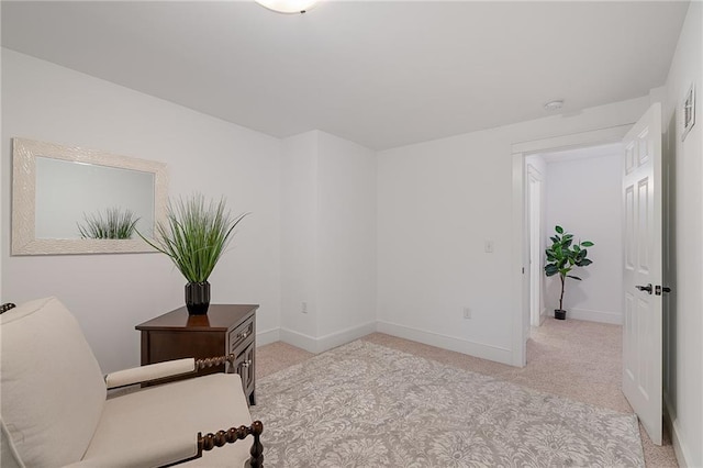 unfurnished room with carpet and baseboards