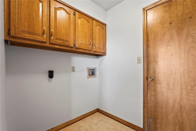 721 Cupid Ct, Raymore, MO 64083 - laundry area with cabinet space, washer hookup, baseboards, and light flooring