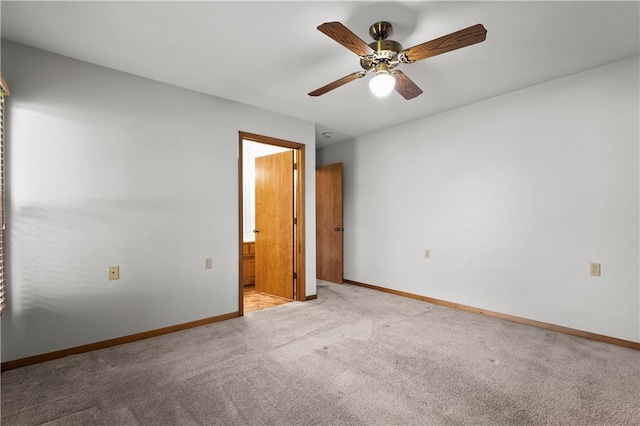 721 Cupid Ct, Raymore, MO 64083 - carpeted empty room with baseboards and ceiling fan
