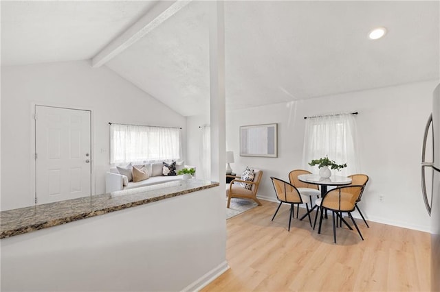 dining space featuring light wood-style floors, healthy amount of natural light, baseboards, and recessed lighting