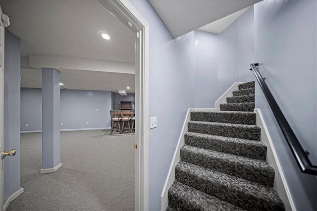 stairway featuring baseboards, carpet flooring, and recessed lighting