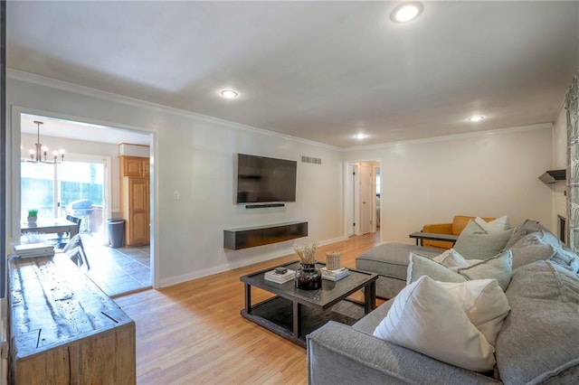 5805 N Belton Ave, Kansas City, MO 64151 - living room with a chandelier, crown molding, baseboards, recessed lighting, and light wood-style floors