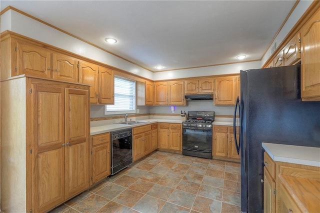 5805 N Belton Ave, Kansas City, MO 64151 - kitchen featuring black appliances, under cabinet range hood, a sink, light countertops, and stone finish flooring