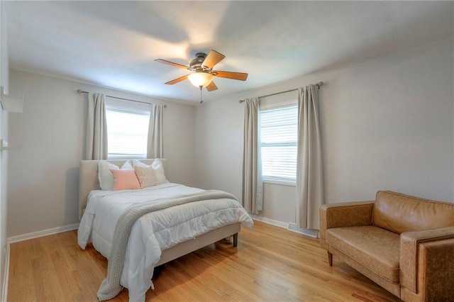 5805 N Belton Ave, Kansas City, MO 64151 - bedroom featuring light wood-style flooring, baseboards, and a ceiling fan