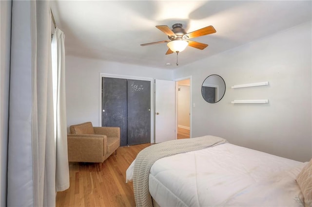 5805 N Belton Ave, Kansas City, MO 64151 - bedroom with light wood finished floors, a closet, and ceiling fan