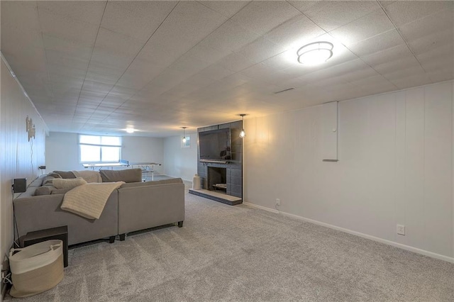5805 N Belton Ave, Kansas City, MO 64151 - living room with light colored carpet, a large fireplace, and baseboards