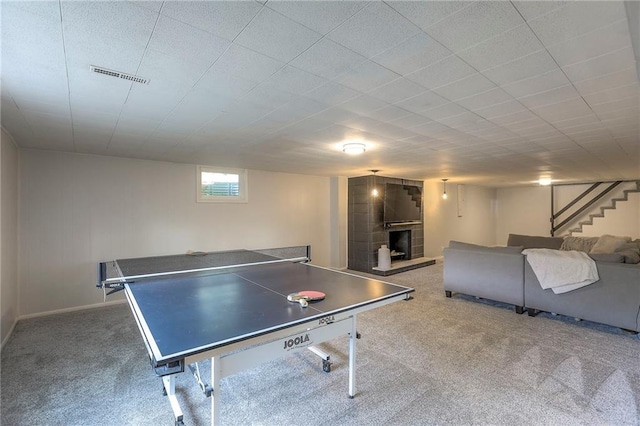 5805 N Belton Ave, Kansas City, MO 64151 - game room with carpet, a fireplace, and baseboards
