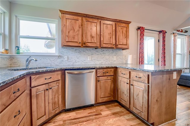 21200 W 47th Ter, Shawnee, KS 66218 - kitchen with dishwasher, a peninsula, stone counters, a sink, and backsplash