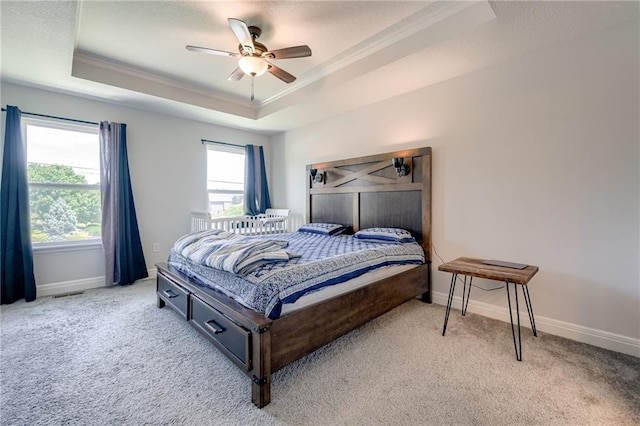 21200 W 47th Ter, Shawnee, KS 66218 - bedroom with a tray ceiling, light colored carpet, crown molding, baseboards, and ceiling fan