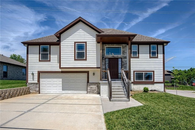 21200 W 47th Ter, Shawnee, KS 66218 - bi-level home featuring stone siding, an attached garage, a front yard, and concrete driveway