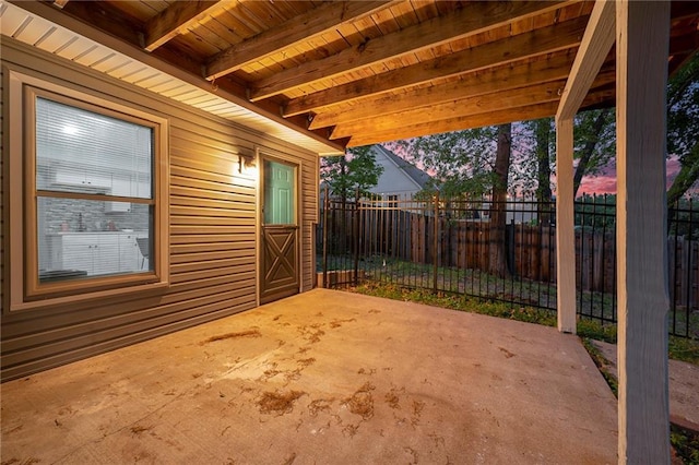 view of patio featuring fence