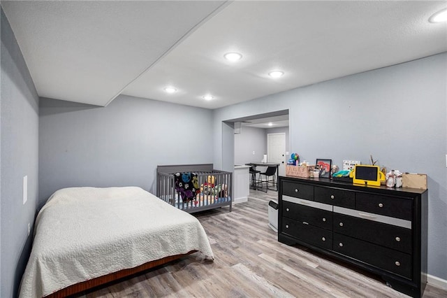 18213 Cliff Dr, Independence, MO 64055 - bedroom featuring light wood finished floors, recessed lighting, and baseboards