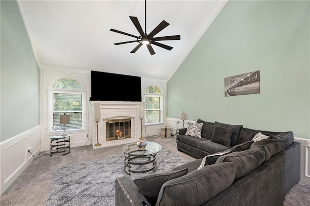 18213 Cliff Dr, Independence, MO 64055 - carpeted living area featuring ceiling fan, healthy amount of natural light, a wainscoted wall, a fireplace, and high vaulted ceiling