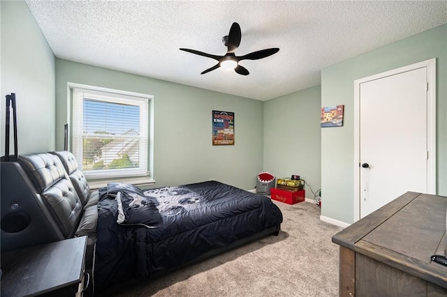 18213 Cliff Dr, Independence, MO 64055 - carpeted bedroom with a textured ceiling, baseboards, and ceiling fan