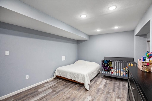 18213 Cliff Dr, Independence, MO 64055 - bedroom featuring baseboards, wood finished floors, and recessed lighting