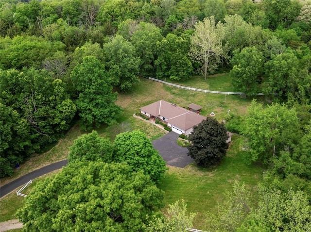 aerial overview of property's location with a forest