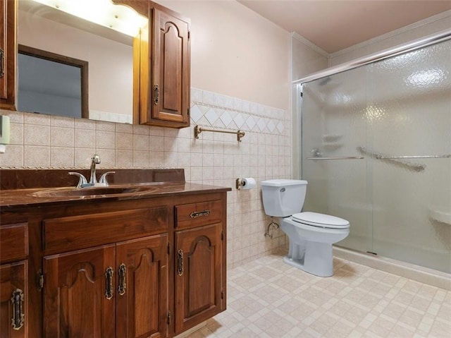 full bath featuring a shower stall, tile walls, vanity, toilet, and tile patterned floors
