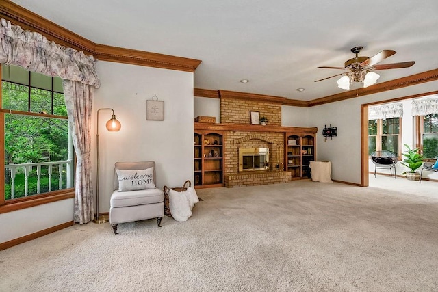 2820 S Victoria Ln, Blue Springs, MO 64015 - living room with healthy amount of natural light, carpet floors, a ceiling fan, crown molding, and baseboards