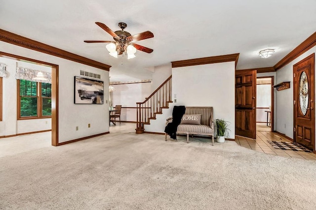 2820 S Victoria Ln, Blue Springs, MO 64015 - living area featuring carpet flooring, ornamental molding, a ceiling fan, baseboards, and stairway