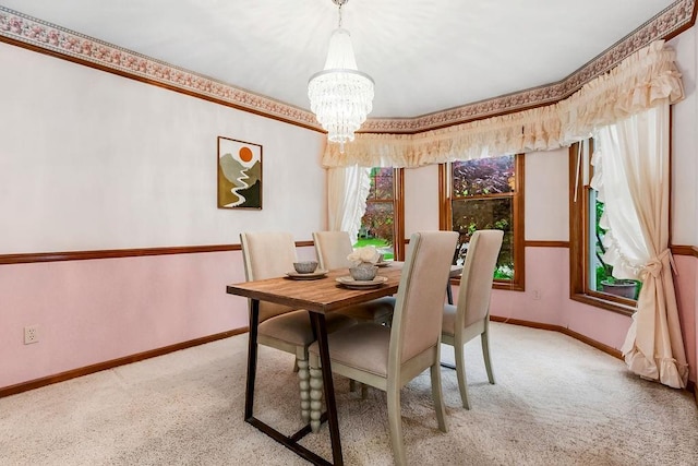 2820 S Victoria Ln, Blue Springs, MO 64015 - carpeted dining room with a chandelier and baseboards