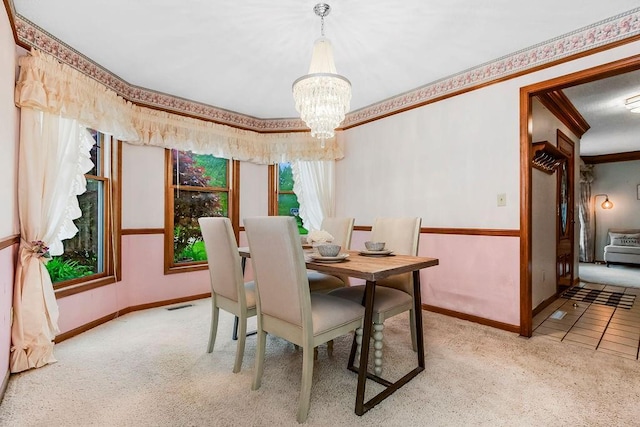 2820 S Victoria Ln, Blue Springs, MO 64015 - dining room with carpet, a chandelier, and baseboards