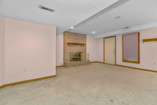 2820 S Victoria Ln, Blue Springs, MO 64015 - unfurnished living room with baseboards, carpet, a fireplace, and recessed lighting
