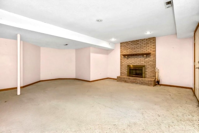 2820 S Victoria Ln, Blue Springs, MO 64015 - finished basement with a brick fireplace, baseboards, recessed lighting, and carpet floors