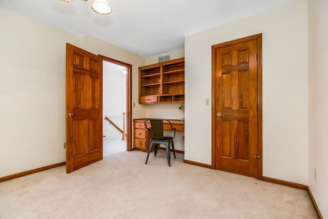 2820 S Victoria Ln, Blue Springs, MO 64015 - office with light colored carpet, baseboards, and built in desk