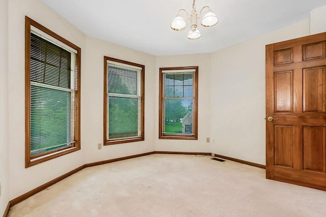 2820 S Victoria Ln, Blue Springs, MO 64015 - empty room with carpet, a chandelier, and baseboards