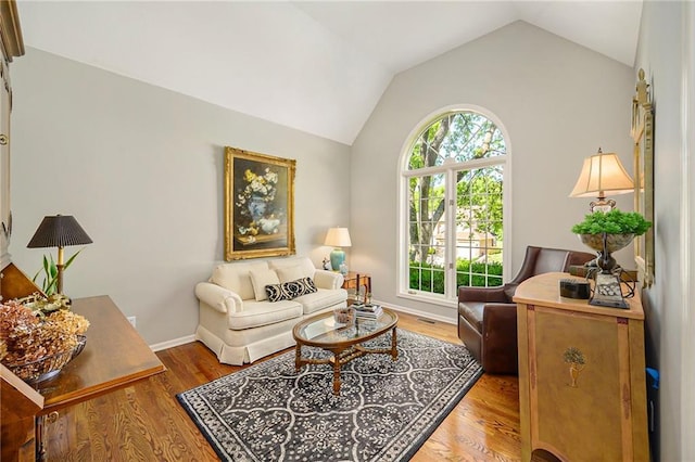 1605 Ridge Rd, Leavenworth, KS 66048 - living area with vaulted ceiling, wood finished floors, and baseboards