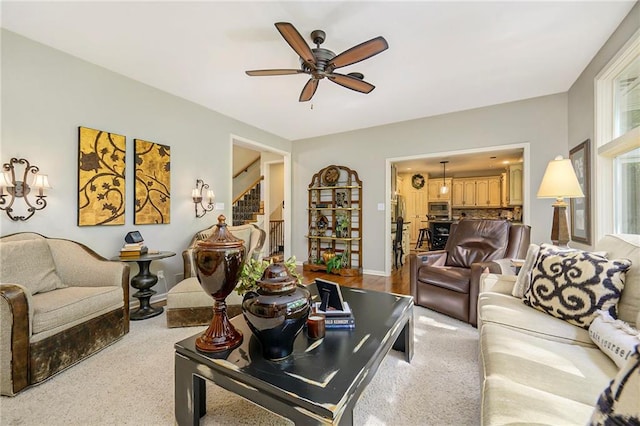 1605 Ridge Rd, Leavenworth, KS 66048 - living area with stairway, a ceiling fan, and baseboards