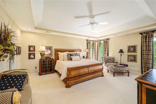 1605 Ridge Rd, Leavenworth, KS 66048 - carpeted bedroom with a tray ceiling, baseboards, and ceiling fan