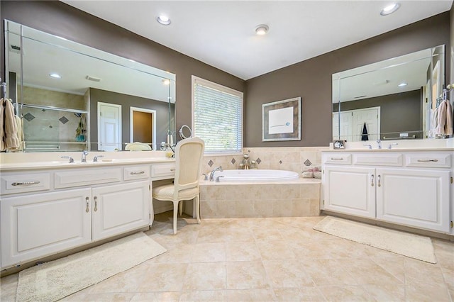 1605 Ridge Rd, Leavenworth, KS 66048 - bathroom with a shower stall, a bath, tile patterned flooring, vanity, and recessed lighting